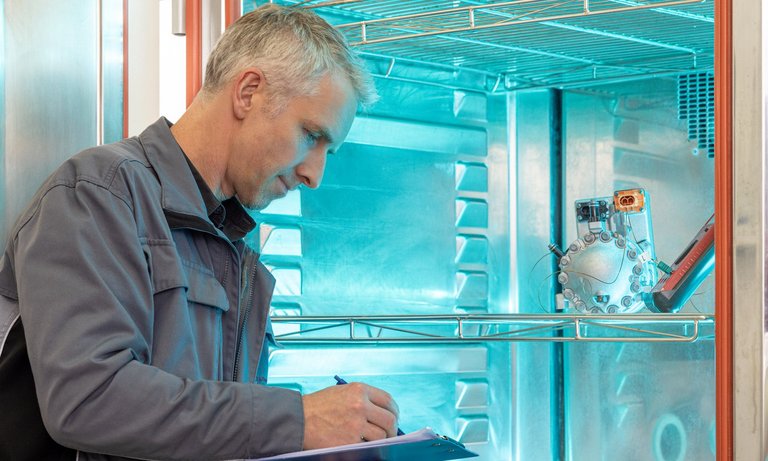 Checking the temperatures in a climate chamber.